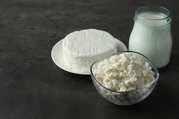 Fresh lactose free products on grey table, space for text