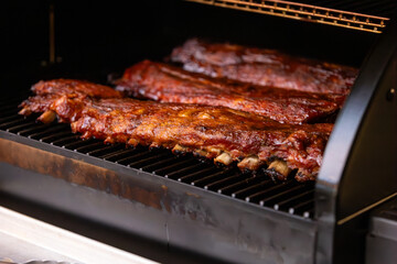 Smoked baby back pork ribs cooked on a pellet grill - obrazy, fototapety, plakaty