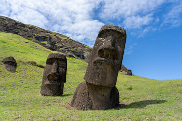 Easter Island, Chile - March 4, 2023: Moai Hinariru (on the right), the &ldquo;crooked neck&rdquo; moai, at Rano Raraku on Easter Island (Rapa Nui), Chile. Rano Raraku is commonly known as the &ldquo;Moai Factory&rdquo;.
