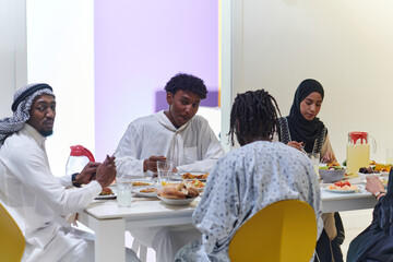 A traditional and diverse Muslim family comes together to share a delicious iftar meal during the sacred month of Ramadan, embodying the essence of familial joy, cultural richness, and spiritual unity