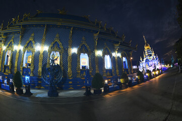Night scene of the beauty blue temple of Wat Rong Suea Ten It is a unique applied art using shades...