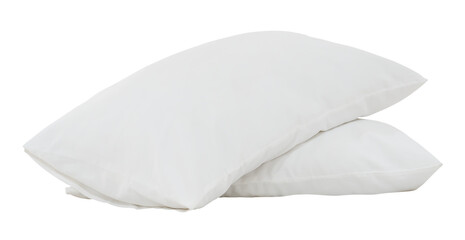 Two white pillows with cases in stack after guest's use in hotel or resort room isolated on white...