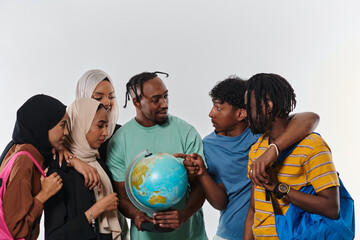 A diverse group of students is gathered around a globe, engrossed in exploration and study, their...