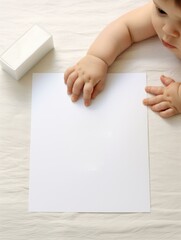 A baby holding a piece of paper with a blank space. Generative AI.