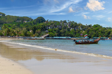 Patong Beach Phuket Thailand nice white sandy beach clear blue and turquoise waters and lovely blue skies with Palms tree