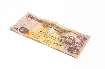 One  banknote of the National Bank of the United Arab Emirates in denominations of five dirhams on a white background