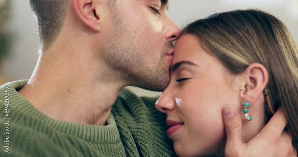 Sticker Couple, love and kiss on head on home sofa with happiness, care and support in healthy marriage. Face of man and woman together in a lounge with affection for trust, bonding time or relax on a couch