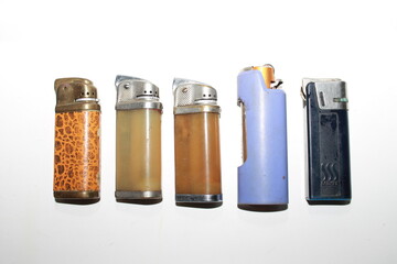 Collection of vintage USSR lighters on a white background.