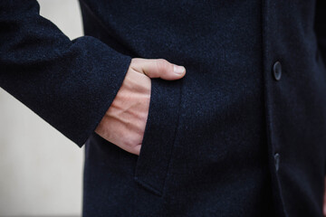 Detail of men's outerwear, fashionable men's black coat