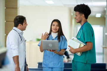 Teacher doctor man and group of medical student standing looking work in laptop. education and learning medical concept. Nurse professional classroom learning. - obrazy, fototapety, plakaty