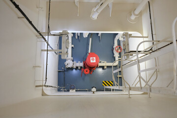 emergency fire pump in engine room of cargo ship