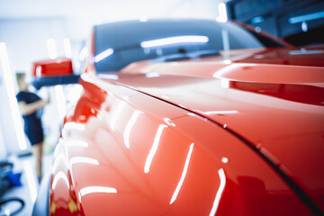 Detailing of clean and shining polished red car