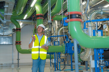 engineer work on chiller plant.  worker  checking  on chiller water plant.