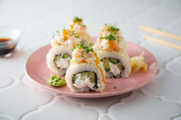 Shrimp sushi rolls with mango sauce