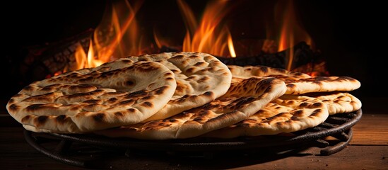 Egyptian flat bread, made with wheat bran, flour, yeast, salt, and water, is baked in very hot ovens to create Aish Baladi or Egypt bread. - obrazy, fototapety, plakaty