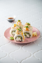 Shrimp sushi rolls with mango sauce