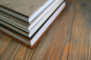 photobooks stacked on top of each other. the concept of making books and albums from photos....