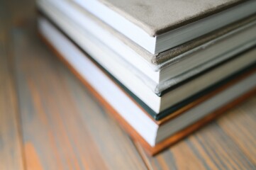 photobooks stacked on top of each other. the concept of making books and albums from photos. services of a professional photographer and printing house