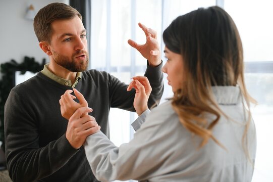 Man beating up his wife illustrating domestic violence