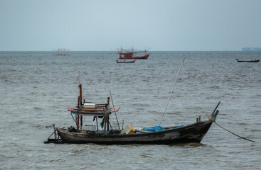 Thai Tradition Wooden Boat floating on the sea