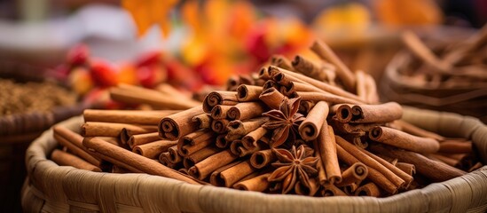 Cinnamon sticks freshly cut and displayed on Sri Lankan fruit market stall. Seasonal harvest. - obrazy, fototapety, plakaty