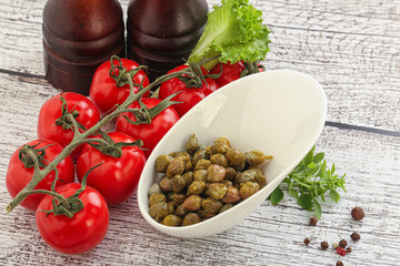Marinated green capers in the bowl