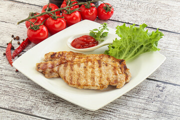 Grilled pork steak with ketchup