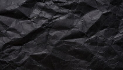 A black crumpled paper background.