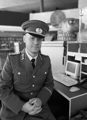 East Berlin border guard at the airport. Interflug is the state airline of the German Democratic...