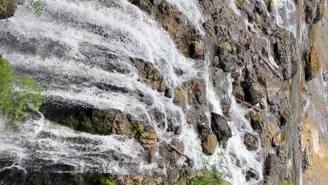 A beautiful view of the upper fall of Englishman river surrounded by mossy rocks and lush forest trees. High quality photo Englishman river falls park Parksville Qualicum Vancouver Island Canada