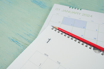 close up of January 2024 calendar on the blue table background, planning for business meeting or...