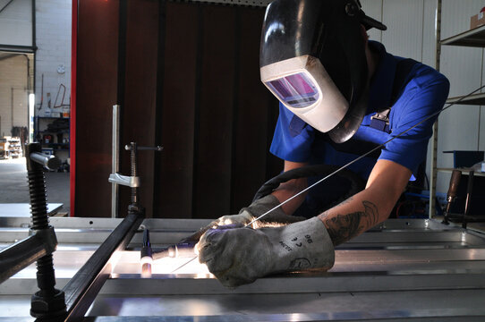 Welder at work at metalworking company (5)