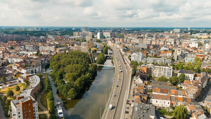 Ghent, Belgium. Esco (Scheldt) river embankment. Panorama of the city from the air. Cloudy weather,...