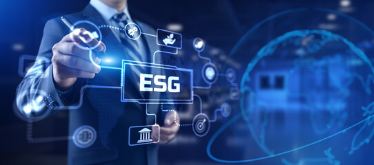 ESG environmental social governance business strategy investing concept. Businessman pressing...