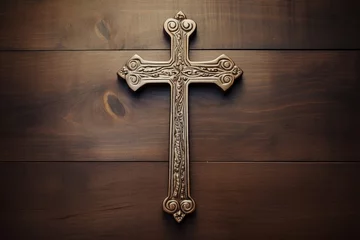 Fotobehang Wooden christian cross on a wooden background.Christian religion concept. © Rudsaphon