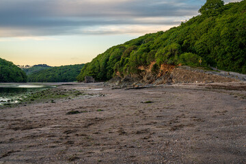 Wonwell Beach and low tide on the River Erme, with an old Lime kiln in the background, near Mothecombe, Devon, England, UK