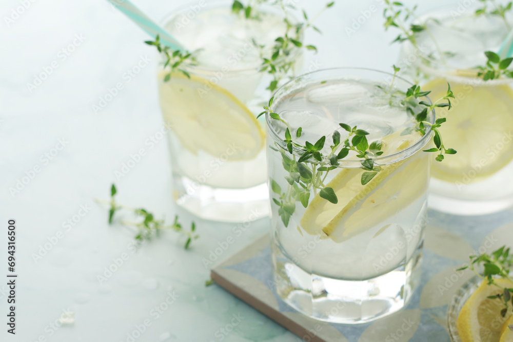 Poster glasses with lemon and thyme refreshing drink