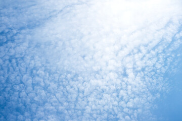 Fluffy white clouds on blue sky