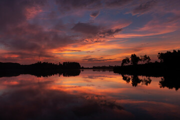 sunrise on lake close of tea fields