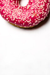 Obraz na płótnie Canvas Sweet pink donut on white background, pink dessert