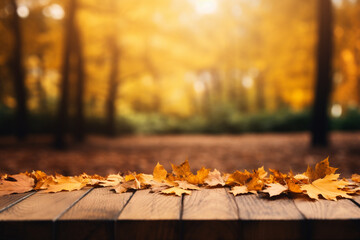 Naklejka na ściany i meble autumn leaves on a wooden blurred table
