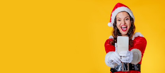 santa claus girl with mobile phone isolated on color background
