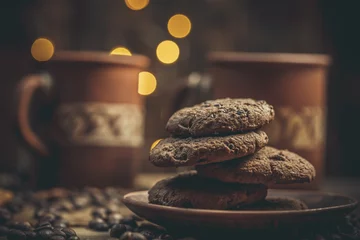 Fotobehang Koffiebar Beautiful mug with coffee and chocolate cookies on a beautiful background, holiday treats
