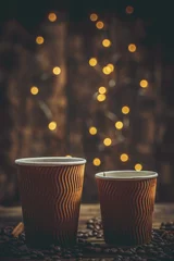 Gordijnen Paper cup with coffee and chocolate cookies on a beautiful background, holiday treats © Anton