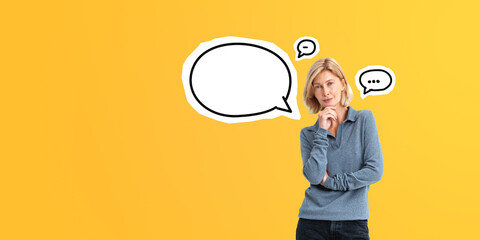 Pensive woman with hand on chin, copy space empty speech bubble