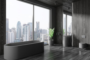 Dark wooden home bathroom interior with sink, toilet and tub near window