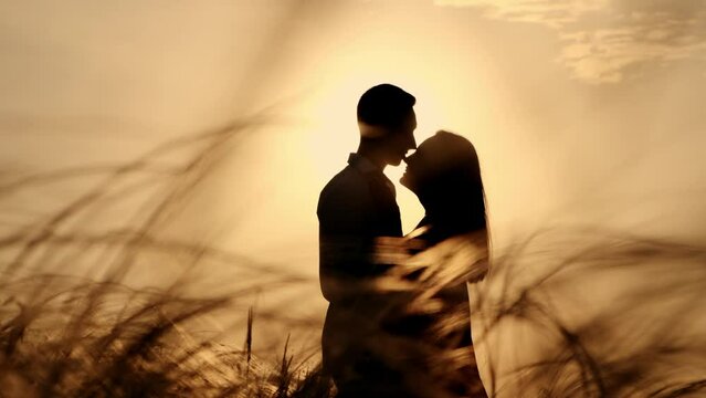 Silhouette of a couple in love in the romance of glamor at sunset