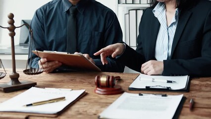 Attorney gives the client a pen to sign a contract admitting fraud, lawyer admits a fraud case in which client is a victim and will sue defendant who is a commercial partner. Fraud litigation concept.