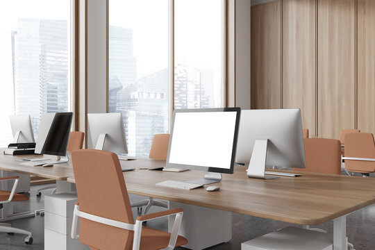 Modern workspace interior with pc desktop mockup display, panoramic window