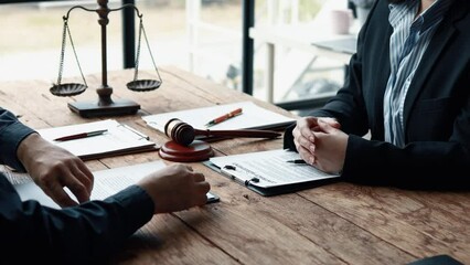 Attorney gives the client a pen to sign a contract admitting fraud, lawyer admits a fraud case in which client is a victim and will sue defendant who is a commercial partner. Fraud litigation concept.